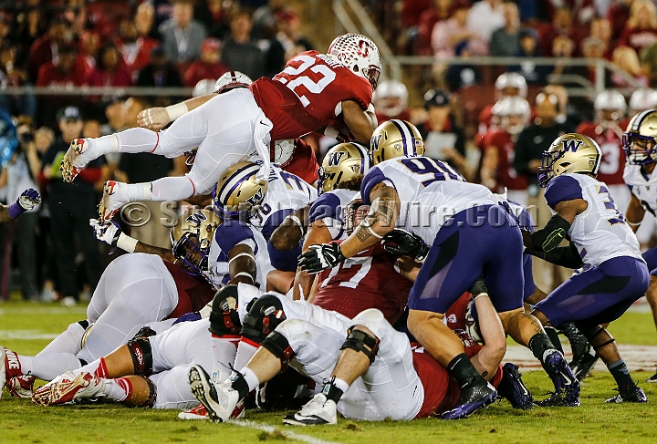 2015StanWash-040.JPG - Oct 24, 2015; Stanford, CA, USA; Stanford Cardinal running back Remound Wright (22) leaps for a first down in the first quarter against the Washington Huskies at Stanford Stadium. Stanford beat Washington 31-14.